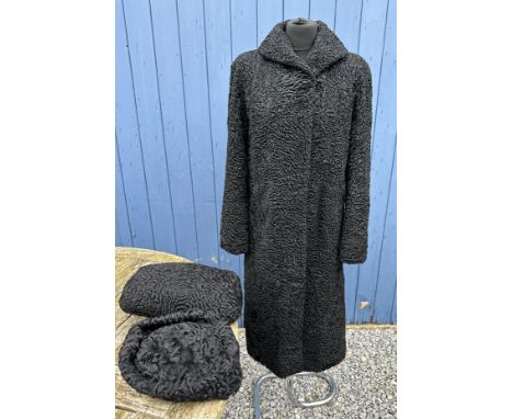 Various items to include a lined curly lambs wool coat along matching bag/muff and hat. Coat measures approx. 112cm from coll