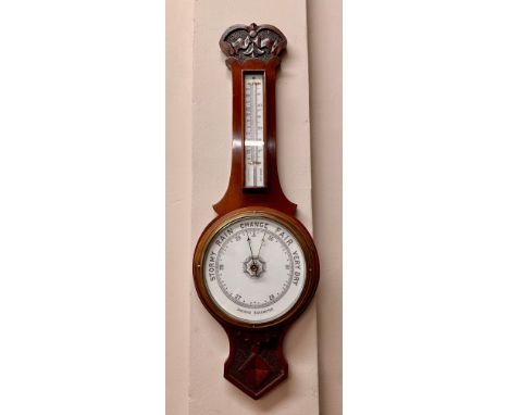 A vintage mahogany aneroid barometer 80cm l, dial 21cm w. 