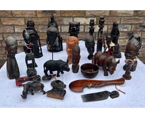 Tribal figures, ornaments, candlestick holders, rhinos, heavy bust of a tribal woman 34cm h and a comb etc. (24) 