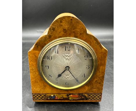 A French walnut mantle clock with bun feet and oriental decorative banner to the base. Movement marked S F and Made in France