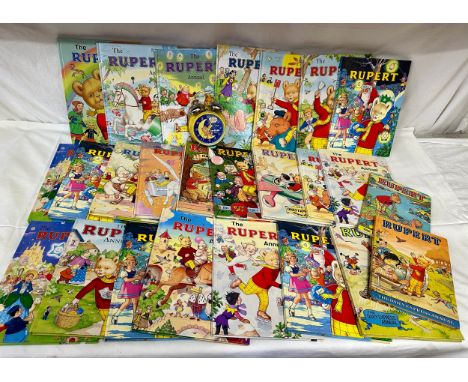 A quantity of Rupert the Bear Annuals and a Garfield 1978 alarm clock. Annuals to include 1975, 1978, 1982, 1983, 1985, 1990,