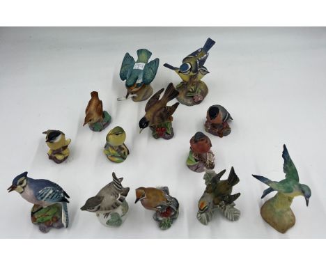 Thirteen various bird figurines to include Royal Worcester Marsh Tit, Wren, American Robin, Chaffinch, Kingfisher, Blue Tits,