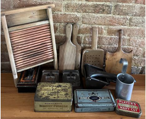 A miscellany to include butter pats, draining scoop, wooden paddle, metal potato masher, metal half pint ladle, tins, inkwell