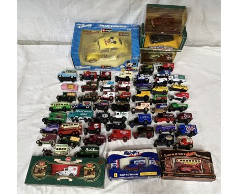 A collection of toy vehicles to include a boxed Disney Burago 1/18 scale beetle, Lledo vehicles, Matchbox, Days Gone By etc. 