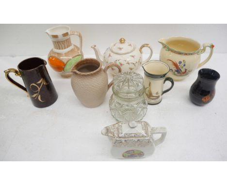 A collection of oriental ceramics including four plates and a Malaysian vase, together with a hand painted Chinese scroll wit