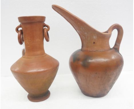 A large terracotta pitcher measuring approximately 40cm tall and a two handled vase 