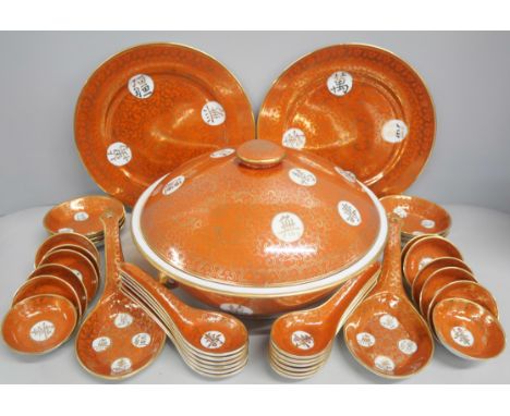 Two boxes of Chinese porcelain orange tea and dinnerware. Comprising of tureen, plates, bowls of various sizes, tea bowls and
