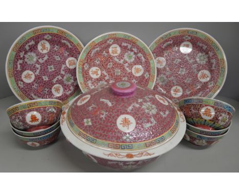 Two boxes of Chinese red dinnerware with famille rose design, comprising of two tureens, plates and bowls, and oval plates va