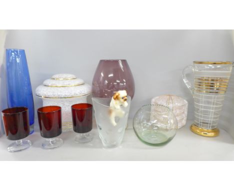 A large collection of glass including two Art Deco light shades, pitcher, vases, large "wine" glass, liquor glasses, etc.