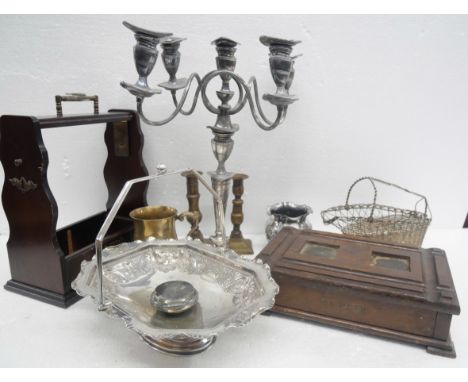 A collection of silver plated items, to include a five arm candelabra, basket, tray, pair of brass candlesticks, a tantalus, 