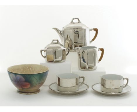 A ceramic and silver overlay bachelor tea set with two cups and saucers, the tea pot H14cm, unmarked, together with an Italia