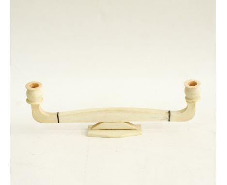 An ivory two arm candlestick, W34cm. Early 20th century. UNRESERVED.