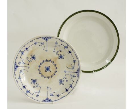 Two large English ceramic serving dishes by Ridgways - Royal Semi Porcelain. One decorated in blue and white and the other wi