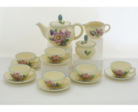 A Czech Ditmar ceramic hand painted tea service comprising of a tea pot and cover, a sugar bowl and cover, a creamer, six cup