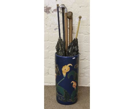 A ceramic stickstand and contents of novelty stick and Pinchbeck umbrellas.