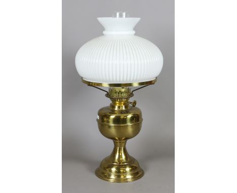An Edwardian brass based oil lamp with milchglas shade.