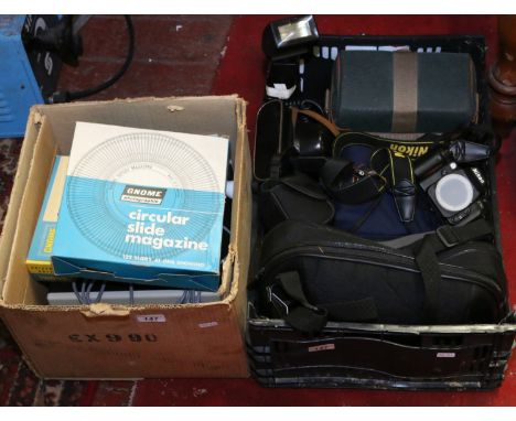 A collection of old photographic equipment including cased cameras, etc. along with a slide projector.