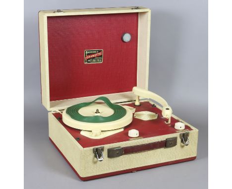 A cased Gramette 240 volt portable electric record player.