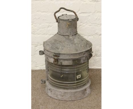 A galvanized metal ships hand lantern marked Meteorite with patent number.