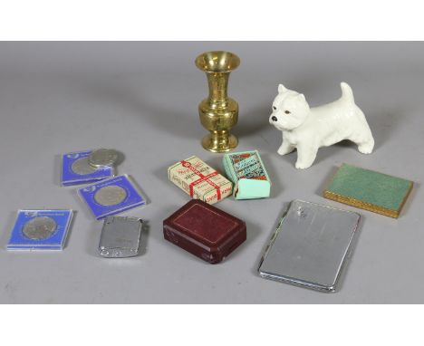 A ceramic Melba ware dog along with a small brass vase, commemorative coins and smoking related items including cigarette car