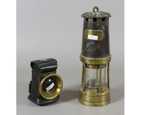 An Eccles type miners safety lamp and an early Lucas cycle lamp.