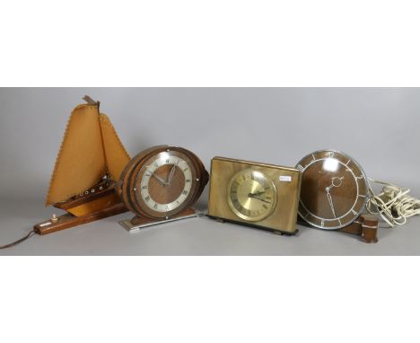 An electric mantel clock and two others along with a novelty tablelamp in the form of a yacht. 