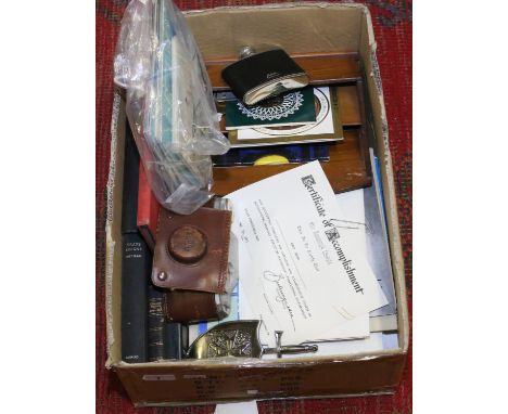 A box of ephemera to include Cunard Queen Mary, old photographs, Pura camera, old letter rack and hip flask, etc.