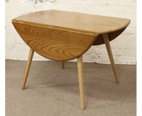 An Ercol Golden Dawn dropleaf table raised on tapering splayed square cut legs.