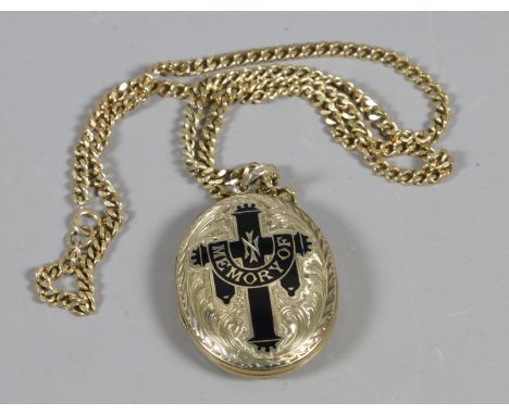 A yellow metal mourning locket with enamel decoration on 9ct gold chain.