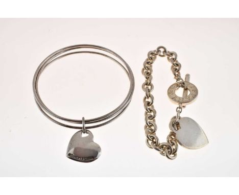 Tiffany &amp; Co '925' sterling silver trinity bangle of three hoops linked with heart fob, 23g, together with a Tiffany &amp