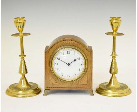 Pair of brass and champleve enamel candlesticks, 20cm high, together with a French inlaid mantel clock having a white Arabic 