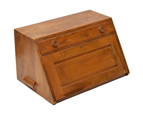 Ercol table top bureau, rectangular form with side carrying handles, the slope front with frieze drawer fitted with divisions