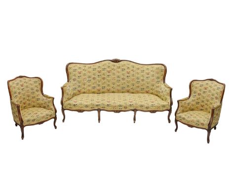 20th century French three-piece salon suite, upholstered in woven floral fabric, comprising sofa and two armchairs, each with