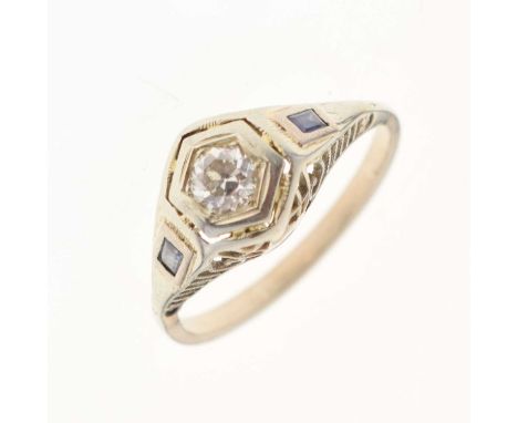 Art Deco-style diamond single stone ring, the old brilliant cut in a hexagonal shaped setting, with a baguette cut sapphire t