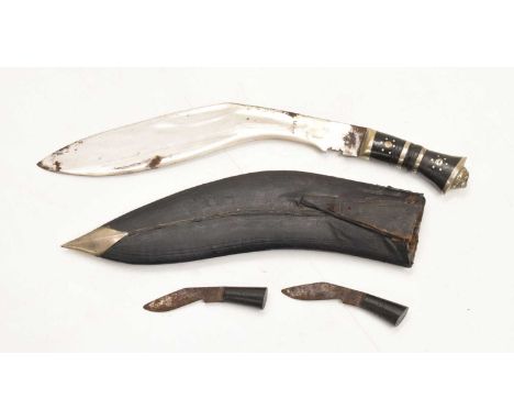 Nepalese kukri of traditional form, with 30cm blade, horn and brass hilt, with scabbard and two subsidiary knives