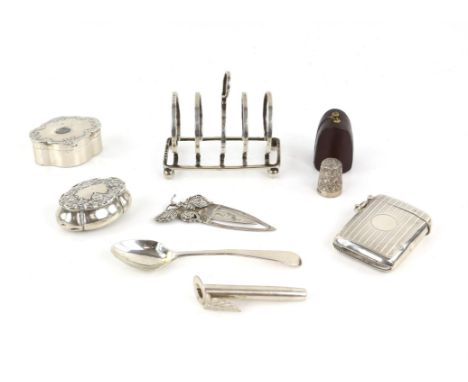 Engine turned silver vesta case, two pin boxes, small toast rack, posy holder, book mark and tea spoon 4.7oz 148.4gm together