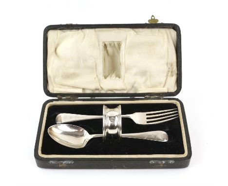 George V three piece silver christening set comprising: fork, spoon and napkin ring, cased, Birmingham 1923