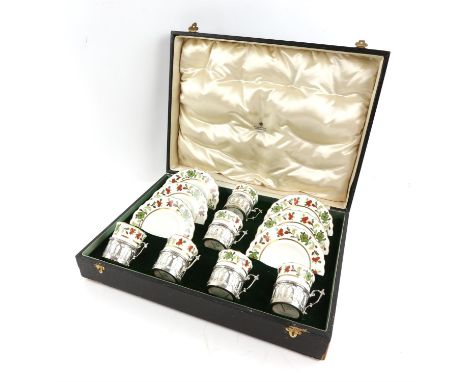 George V Aynsley coffee set with six coffee cups in silver holders, London 1912, and saucers, RdNo 589744, in fitted case, re