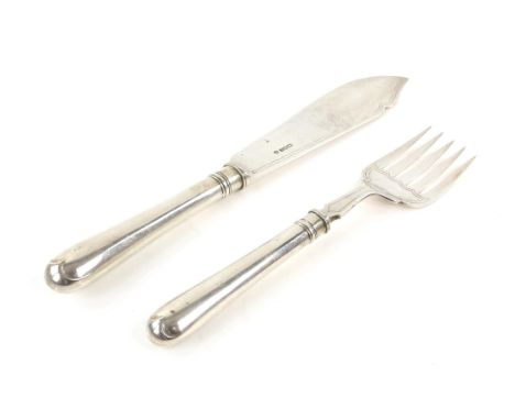 Two silver fish servers, including a knife and fork, Thomas Bradbury & Sons, Sheffield 1928, gross weight 8.52 oz., 31cm and 