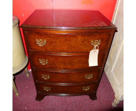 A walnut bow fronted chest fitted four drawers on bracket feet