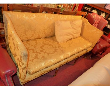 A 19th century mahogany three seater sofa upholstered in gold foliate damask raised on turned supports 