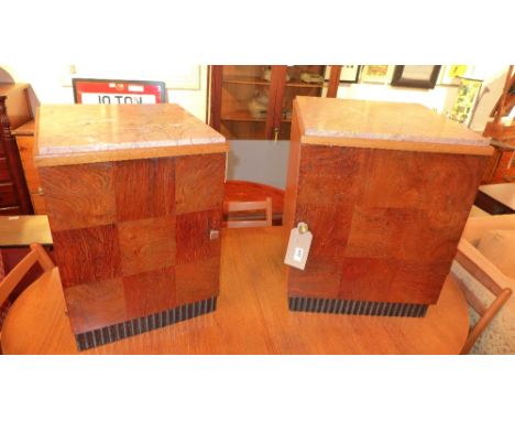 A pair of Art Deco style marble topped walnut bedside cabinets fitted single panel door enclosing shelf and raised on ebonise