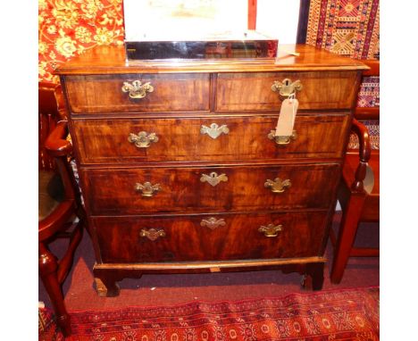 An 18th century walnut and crossbanded chest fitted two short and three long drawers with brass plate handles on bracket feet