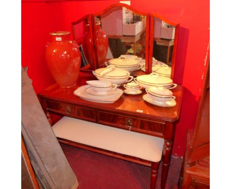 A mahogany dressing table with mirrored back and two drawers with dressing stool 