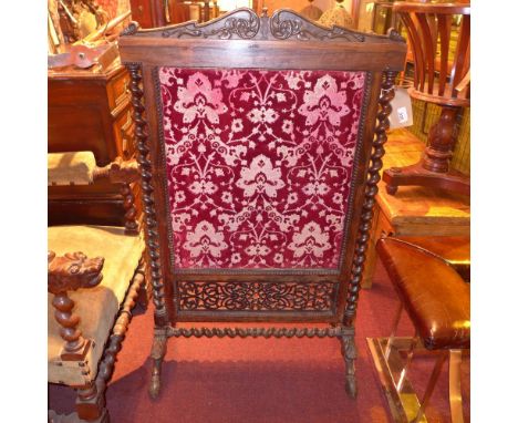 An Anglo Indian William IV Rosewood fire screen with carved detail and a later panel, flanked by barley twists raised on carv