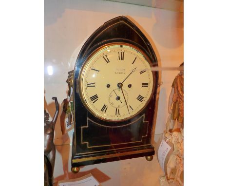 An ebonised regency bracket clock by Allen of London, of lancet form having Roman numerals to the circular dial, pierced and 