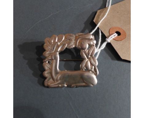 A silver Jorge Jensen style brooch with squirrel and deer in relief