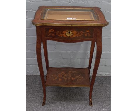 A late 19th century French gilt metal mounted marquetry inlaid kingwood bijouterie table, with glazed top over frieze drawer,