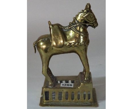 An Indian brass model of a horse, standing four square on a rectangular pierced base, 24cm high. Condition Report Probably la