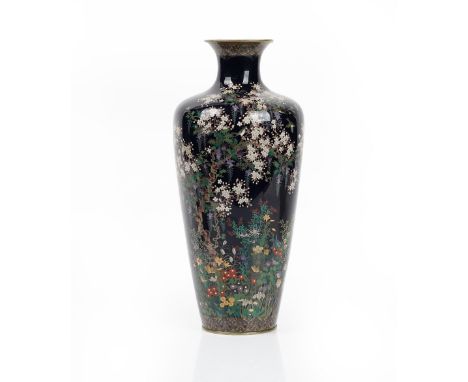 A tall Japanese cloisonné shouldered ovoid vase, Meiji period, worked with birds amongst branches of flowering wisteria and o